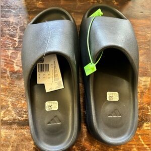 Yeezy slides, men’s size 14, black, brand new never worn